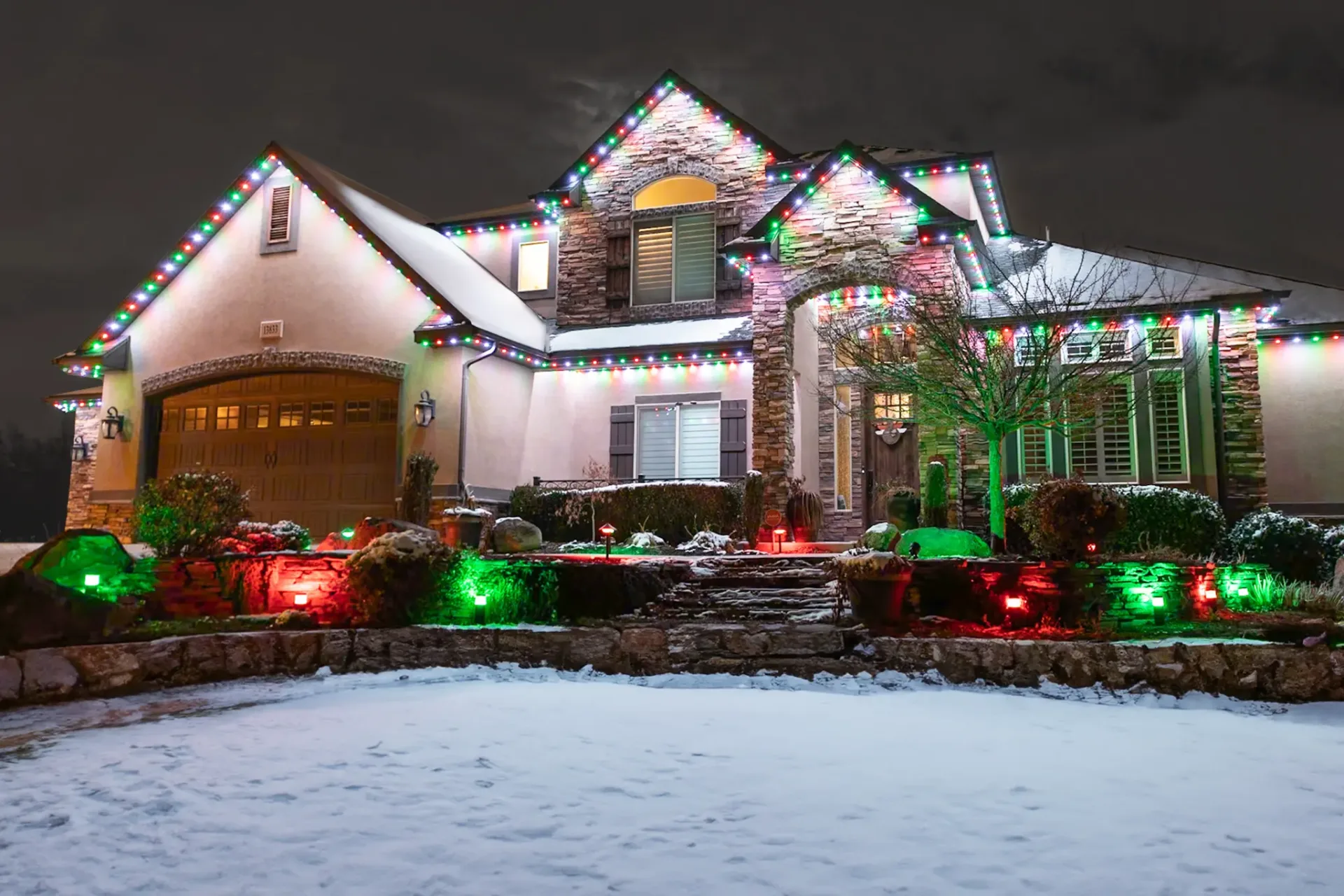 Home with red and green permanent Christmas lights