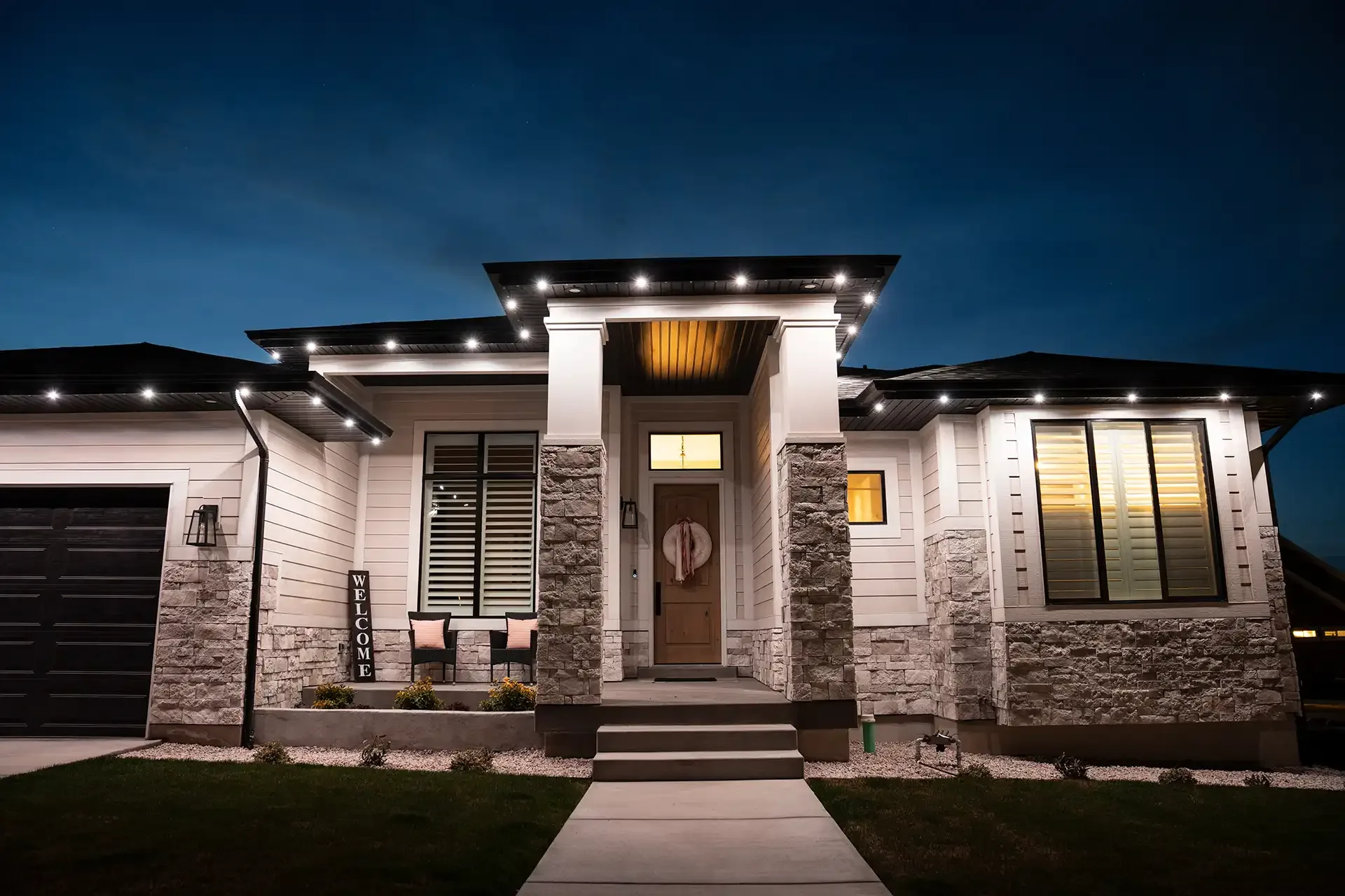 Home with Happy's lighting at dusk