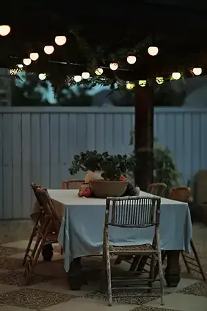 Outdoor dining patio lit with Happy's patio lights